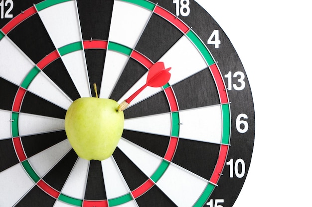 Concept achieving goal.achieving goals in business and
life.dartboard with darts stuck right bullseye.