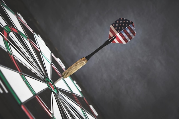 Concept achieving goal.achieving goals in business, politics\
and life.dartboard with darts painted with american flag stuck\
right into target.