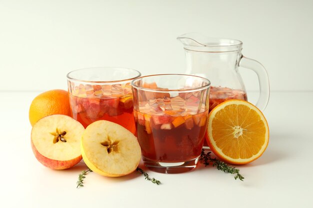 Photo concept of alcohol drink with sangria on white table