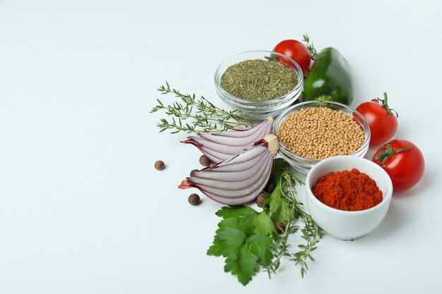 Concept of aromatic spices on white background