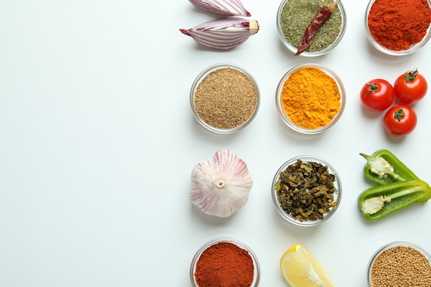 Concept of aromatic spices on white background