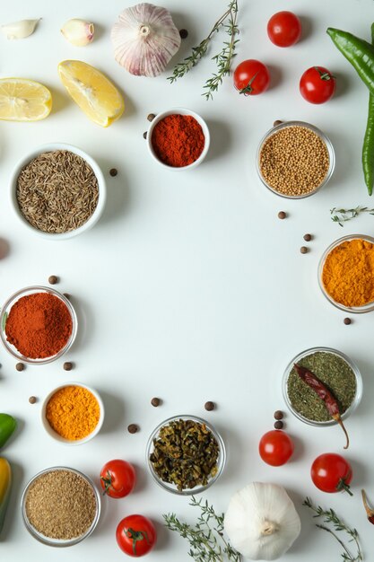 Photo concept of aromatic spices on white background