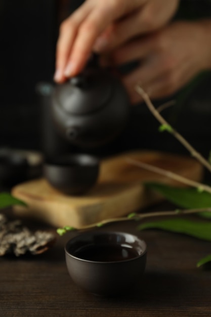 The concept of Asian tea on a dark background with plants
