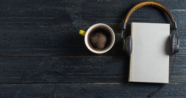 Concept audio books on a dark wooden table