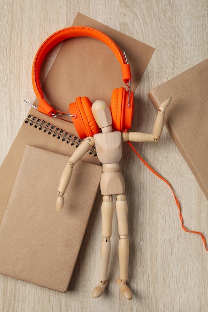 Photo concept of audiobook with books and headphones top view