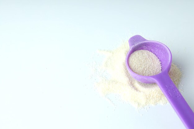 Concept of baby food with Ñowdered milk on white background