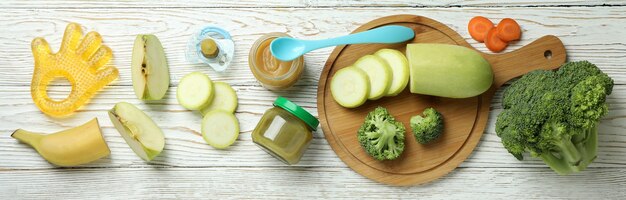 Concept of baby food on wooden table