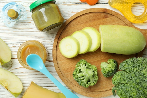 Concept of baby food on wooden table