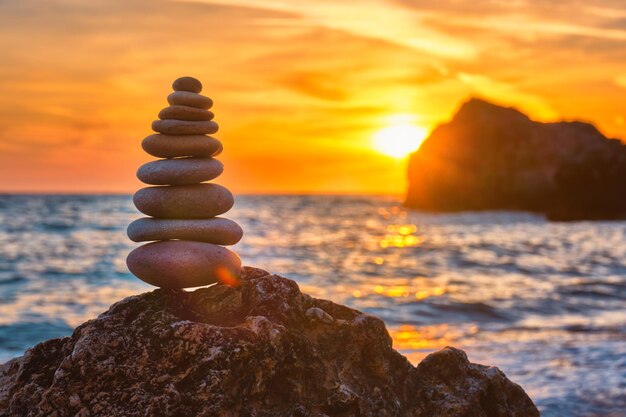 Concept of balance and harmony stone stack on the beach