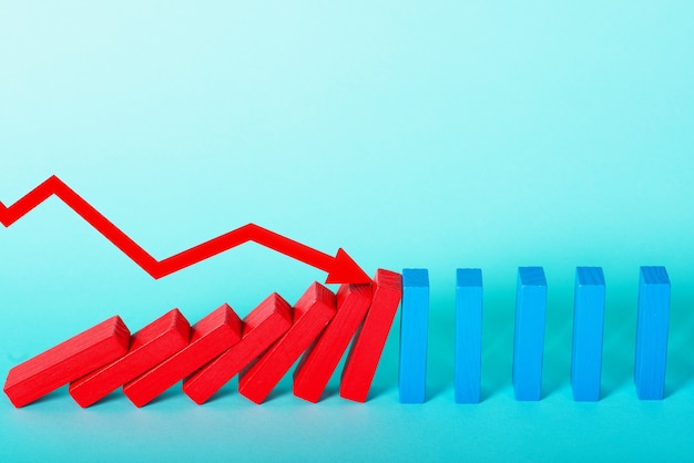 Concept of bankruptcy with falling chain like a domino game and decreasing