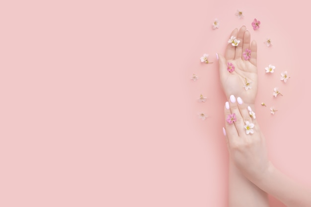 Concept beauty. Natural beauty hand cosmetics with flower extract product. Summer Fashion woman hand
