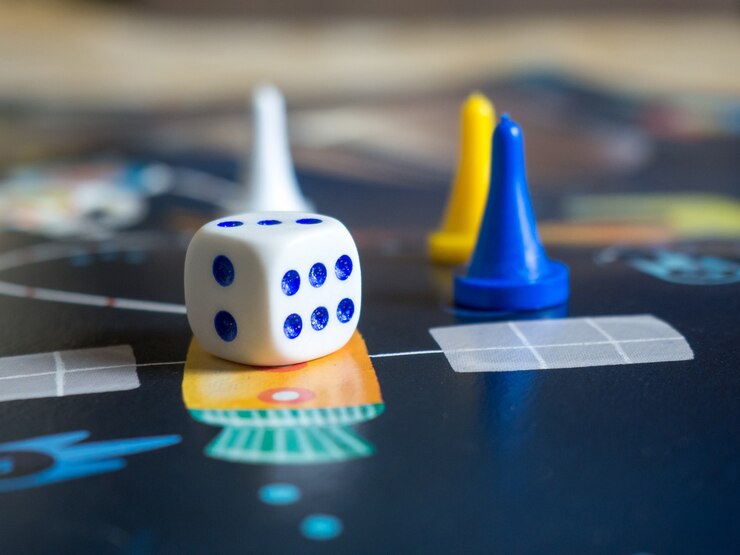 The concept of the board game is a board game board, many pieces, dice, home entertainment for the family