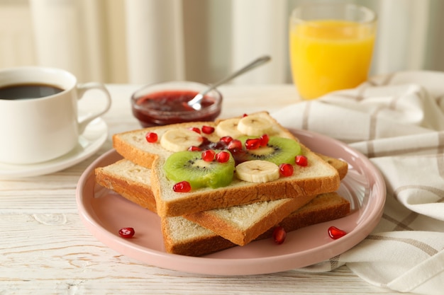 Concept of breakfast with sweet toast with fruits