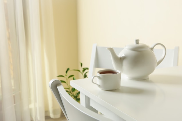 Photo concept of breakfast with tea on white table