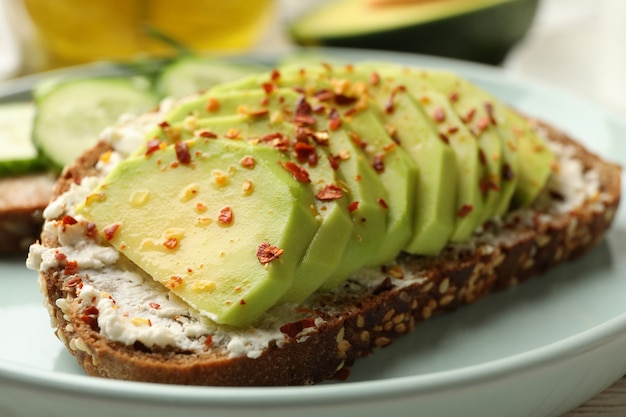 Concept of breakfast with toast with avocado, close up