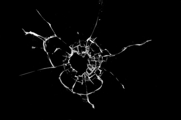 Concept of broken glass with hole for design on black background