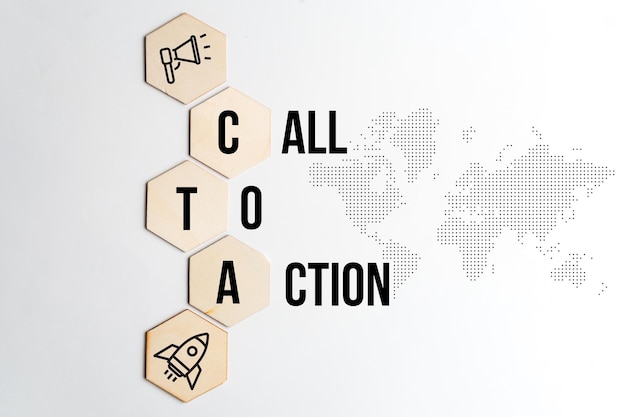 Concept call to action or CTA Text and icons on wooden blocks