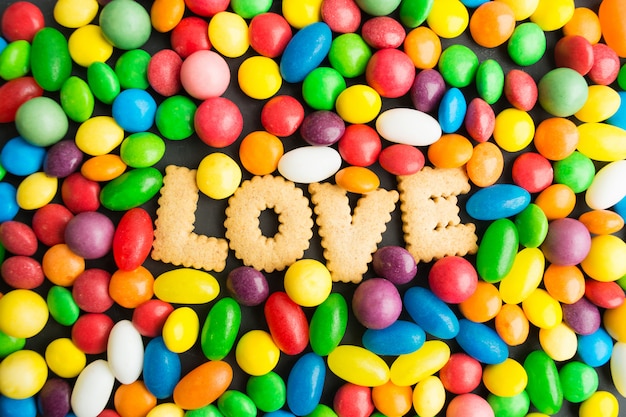 Concept of candies love, colorful candies with cookies