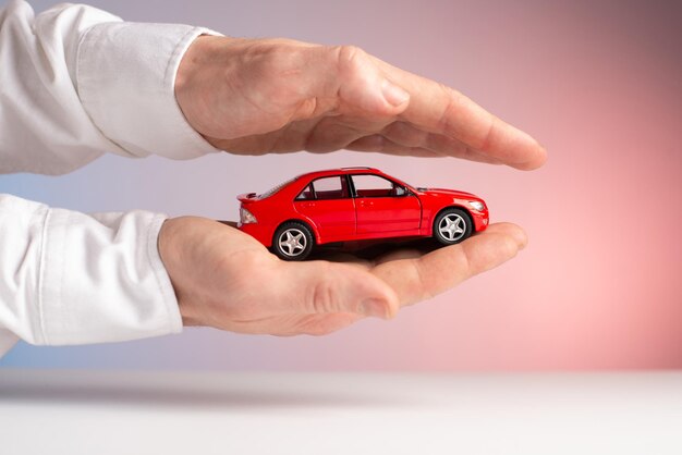 Photo concept car insurance red car accident in hand