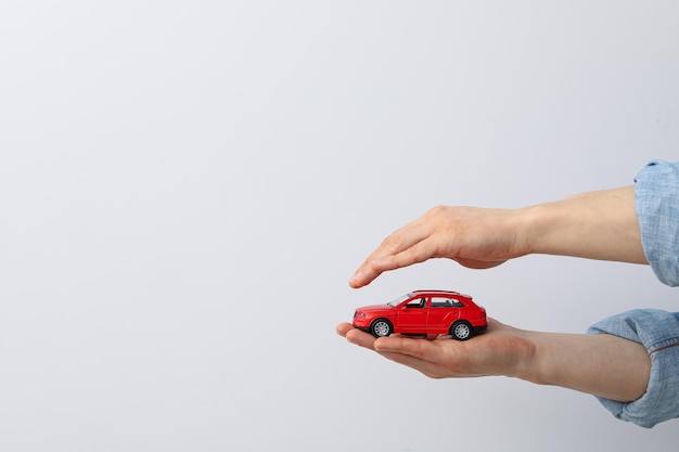 Concept of car purchase and insurance with toy car