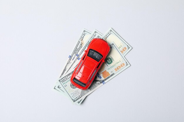 Concept of car purchase and insurance with toy car