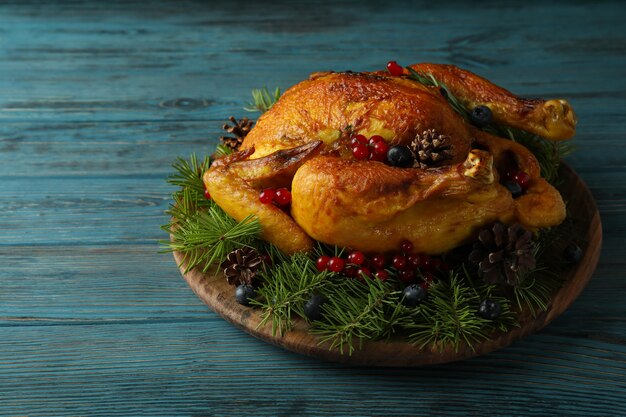 Concept of Christmas roast turkey on wooden table