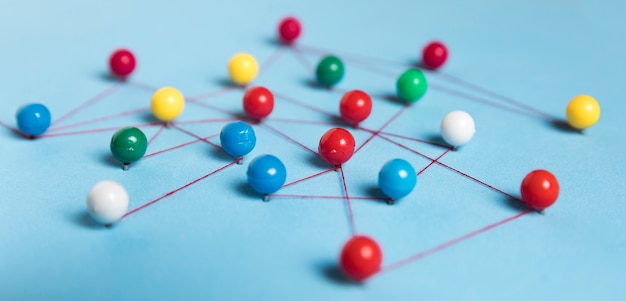 Photo concept of communication with pins blue background