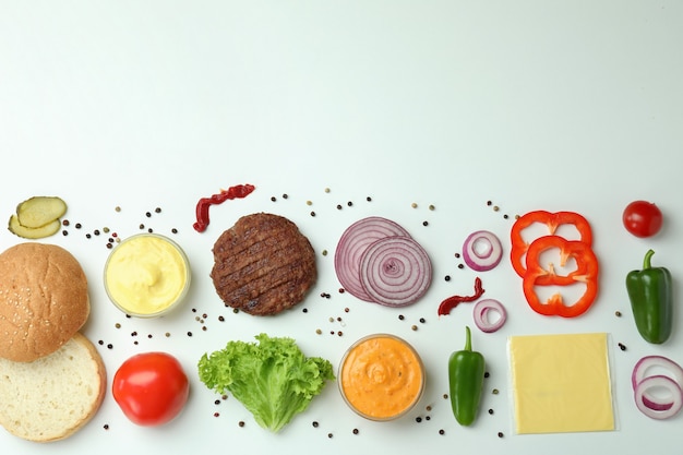 Concept of cooking burger on white background, top view