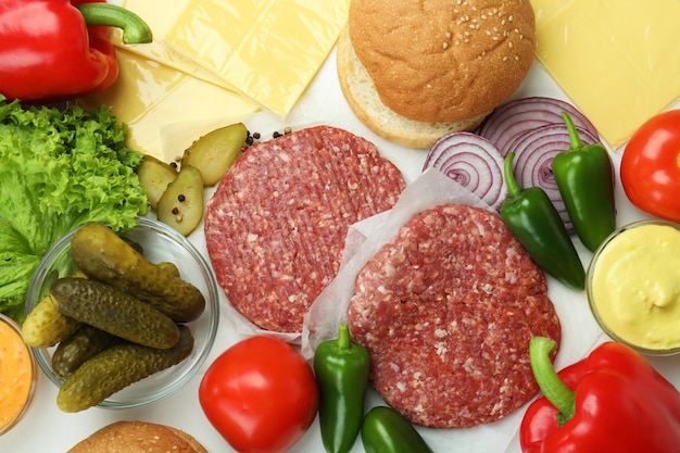 Concept of cooking burger on white background