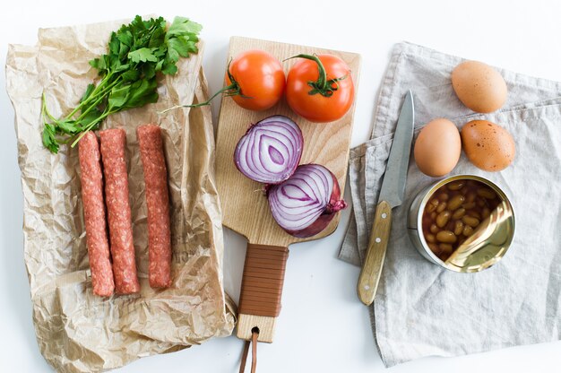 The concept of cooking an English Breakfast on a white background and space for text.