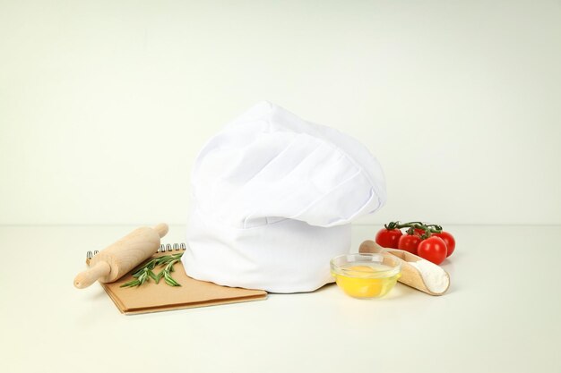 Concept of cooking food with chef hat