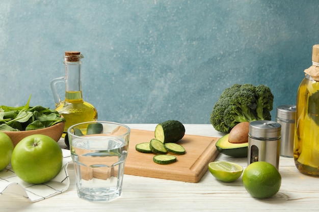 Concept of cooking salad on wooden table