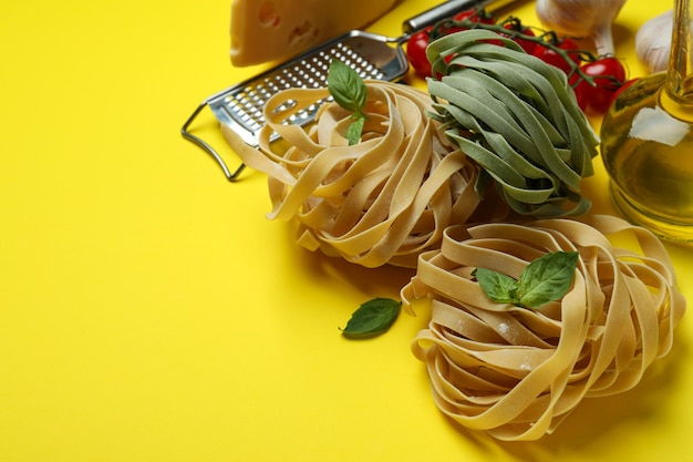 Concept of cooking tasty pasta on yellow