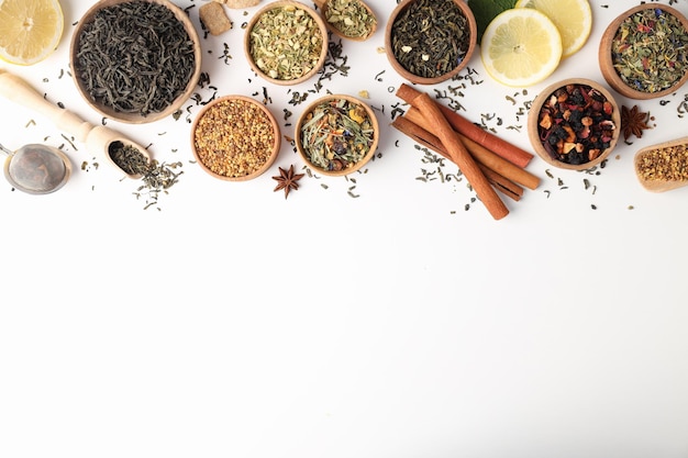 Concept of cooking tea with different types of tea on white background