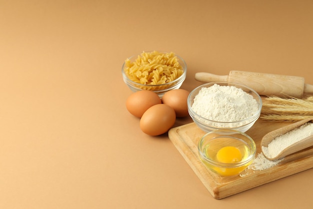 Concept of cooking with ingredients on beige background space for text