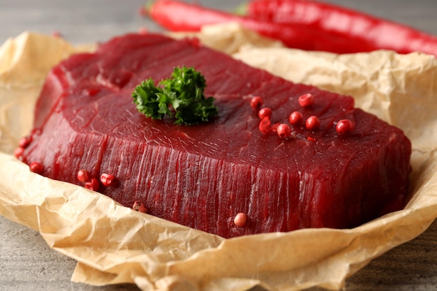 Concept of cooking with raw beef steak, close up