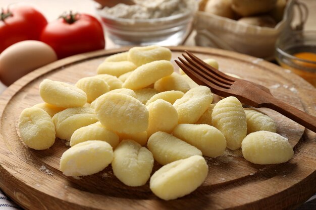 Concept of cooking with raw potato gnocchi close up