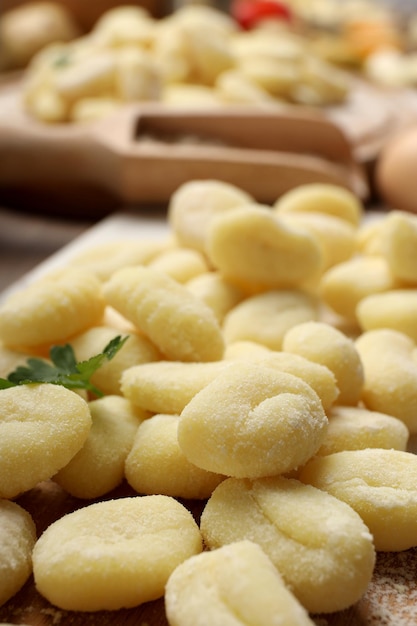 Concept of cooking with raw potato gnocchi close up