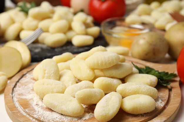 Concept of cooking with raw potato gnocchi close up