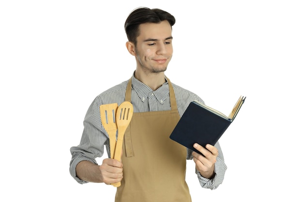 흰색 배경에 고립 된 젊은 매력적인 남자와 요리의 개념