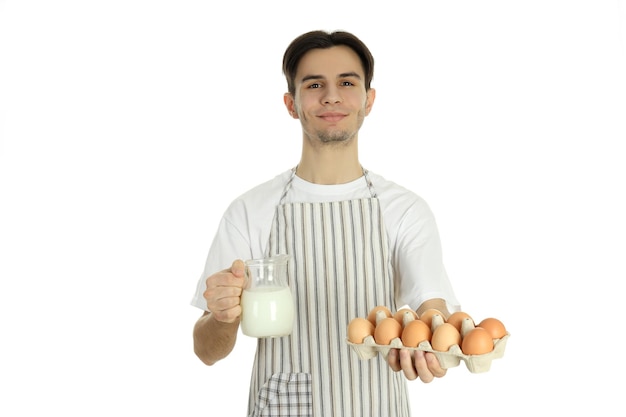 Concept of cooking young man in apron isolated on white background