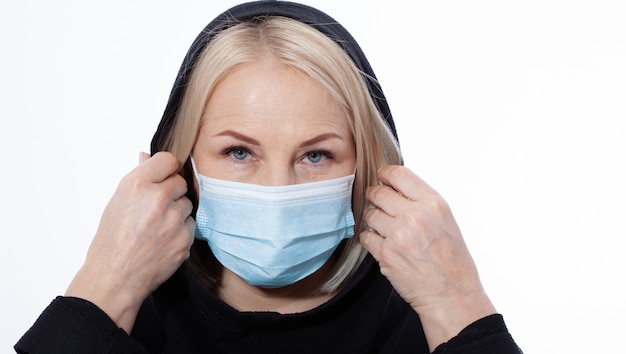 Concept coronavirus, covid-19 respiratory virus. Woman wearing face mask.