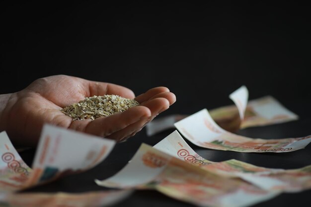 The concept of the cost of grain 5000 ruble banknotes around a
handful of ground grain world hunger