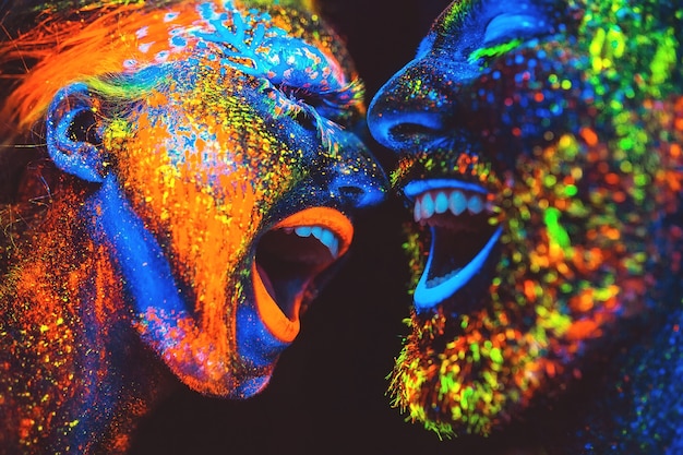 Concept. couple smiling. portrait of a pair of lovers painted in fluorescent powder.