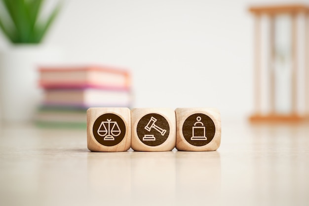 Concept of court, justice and lawyer icons on wooden cubes.