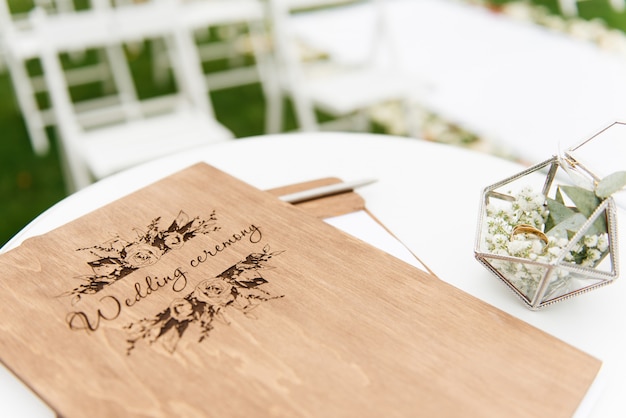 Photo concept of decoration for wedding and holiday wood folder for the wedding ceremony