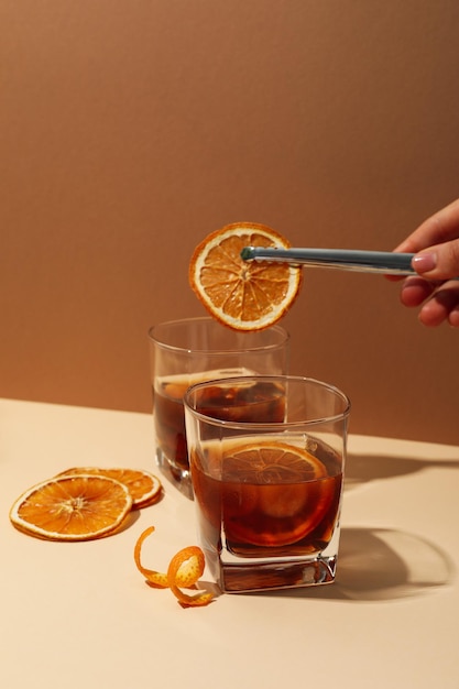 Concept of delicious alcohol drink Whiskey with orange