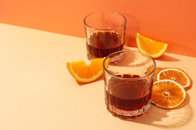 Concept of delicious alcohol drink Whiskey with orange