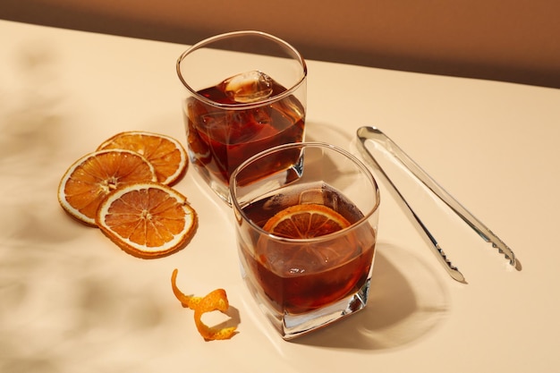 Concept of delicious alcohol drink Whiskey with orange