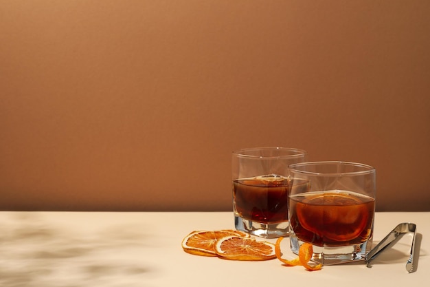 Concept of delicious alcohol drink Whiskey with orange